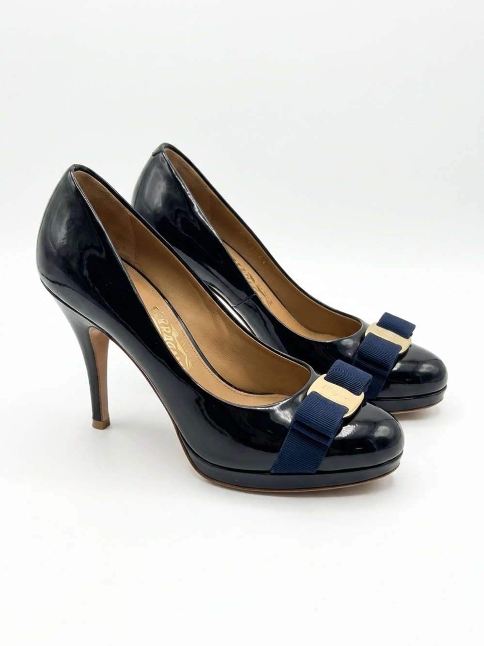 Salvatore Ferragamo Navy Patent Pumps with Navy Bow and Gold Plaque